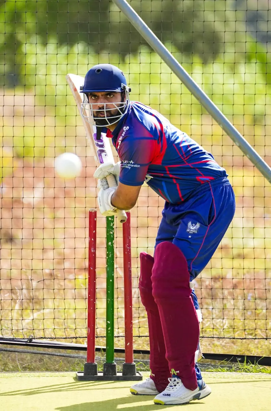 Batsman playing a shot in the practice nets