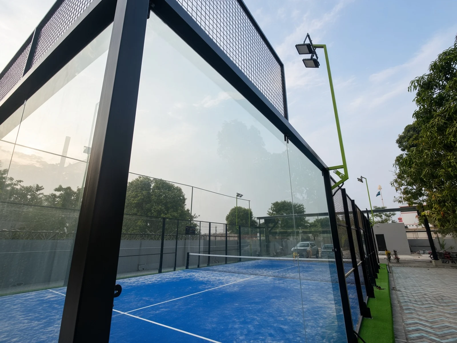 Padel coaching on a glass court